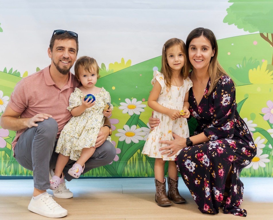 Family photo of parents with two small children