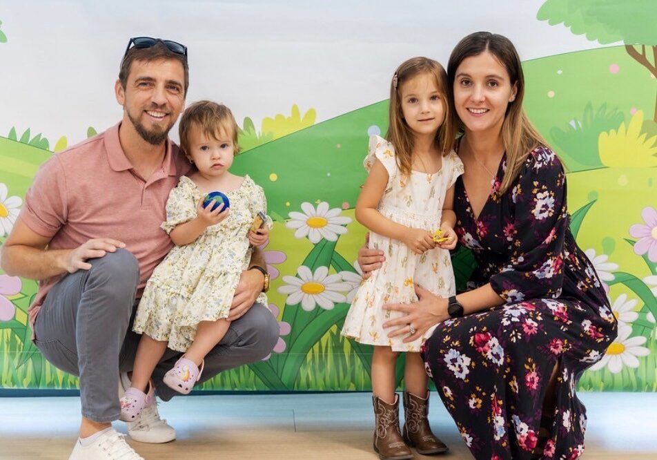 Family photo of parents with two small children